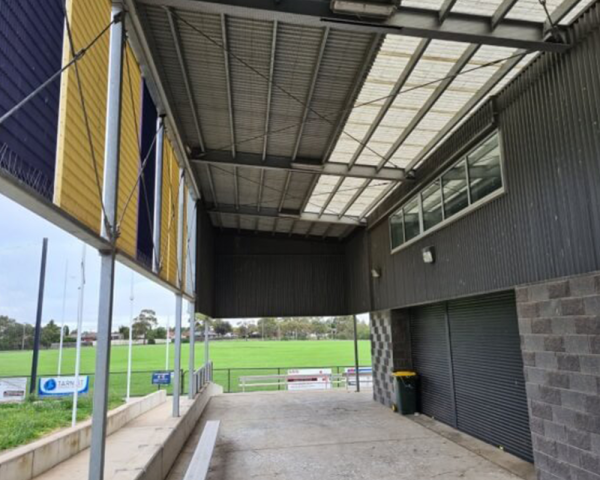 A completed AvePro 19mm bird netting install under a primary-school covered walkway, a real Pest IT job.