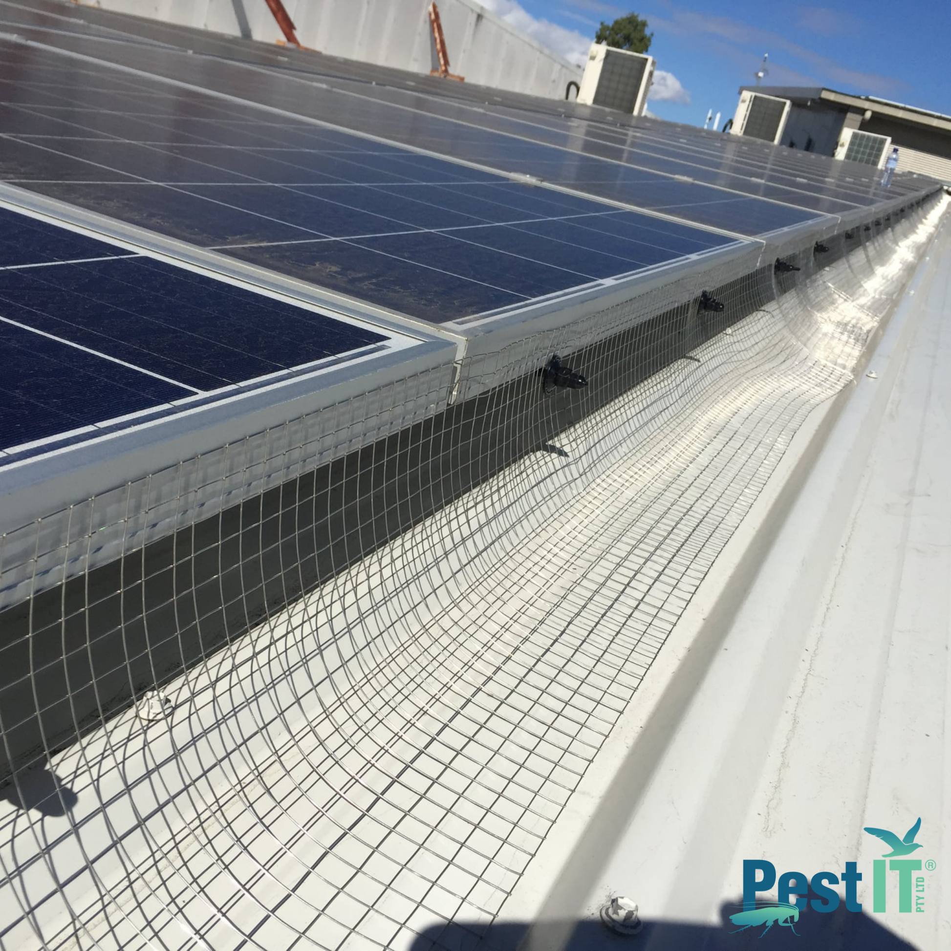 Avepro Solar Mesh Stainless Steel In Use On Commercial Building With Solar Panels